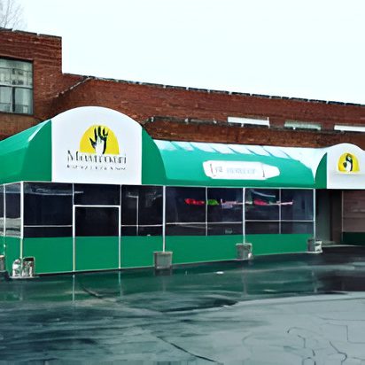 Exterior of a green and white canopy over a building entrance.